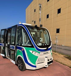 Navya Autonomous Shuttle, driverless electric vehicle, autonomous stack, R&D, advanced drive-by-wire technology, urban mobility, sustainable transportation.